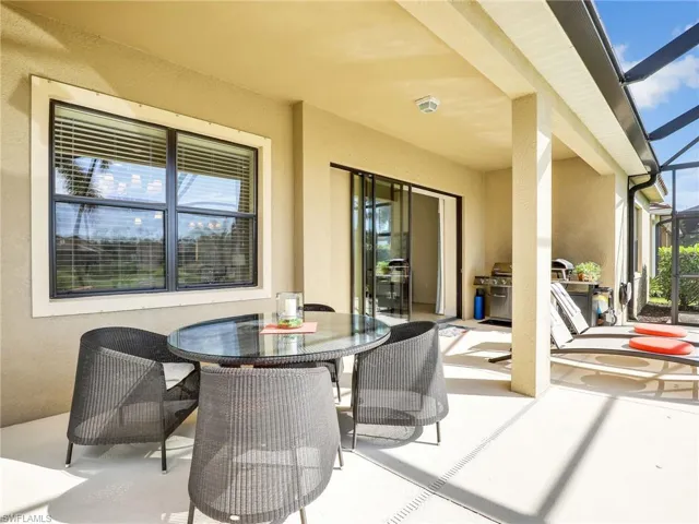 View of patio / terrace featuring glass enclosure and outdoor dining area