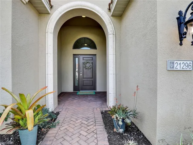 Entrance to property featuring stucco siding