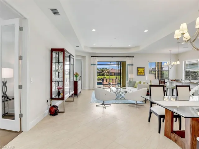 Dining area featuring a chandelier, a wealth of natural light, visible vents, and recessed lighting