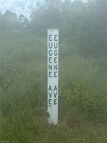 Sign post at SR74 paved road by mailboxes