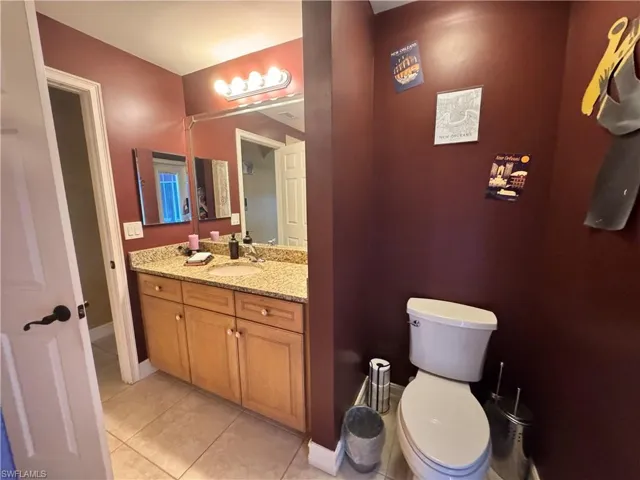 Bathroom with vanity and light tile patterned floors