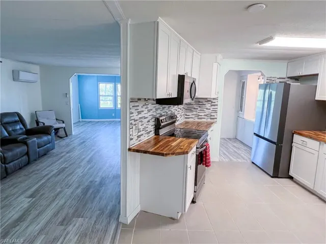 Kitchen looking into living room