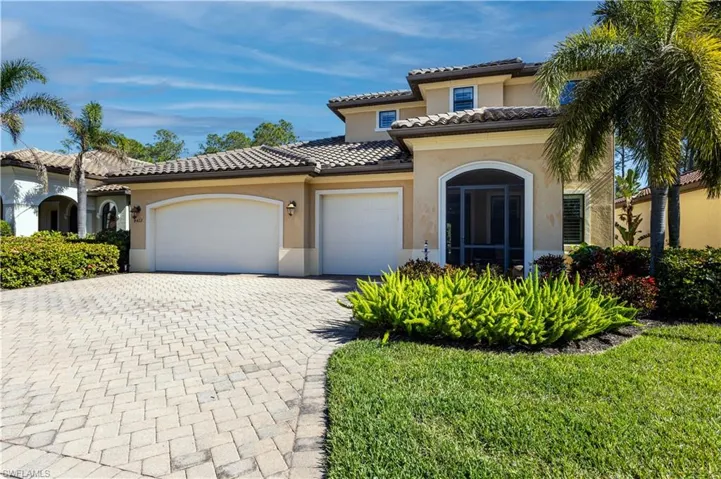 Mediterranean / spanish home featuring a garage