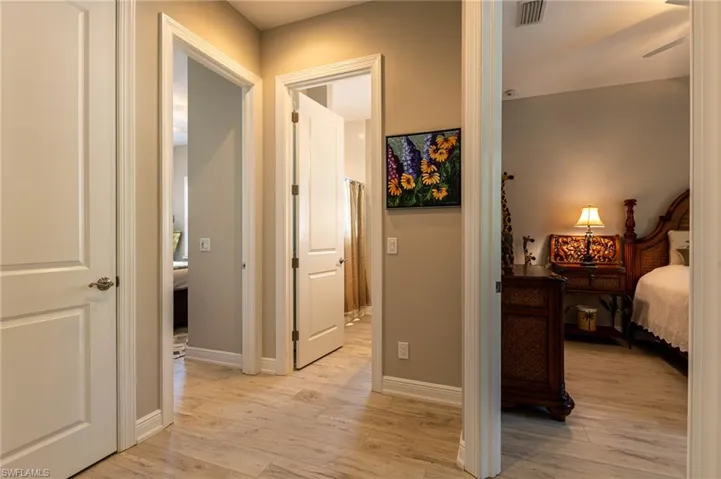 Corridor with light wood-type flooring