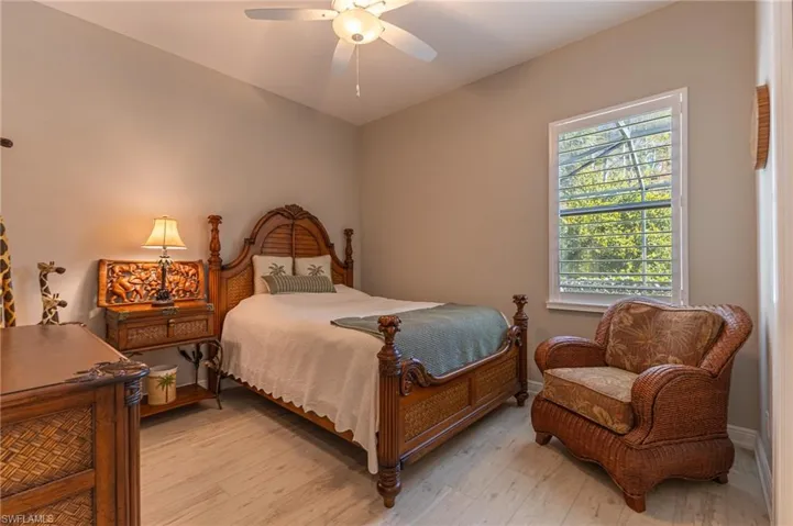 Bedroom featuring ceiling fan and light hardwood / wood-style flooring