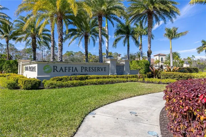 Community / neighborhood sign with a lawn