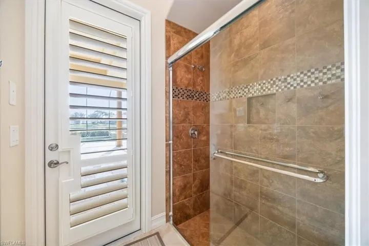 Bathroom with a tile shower