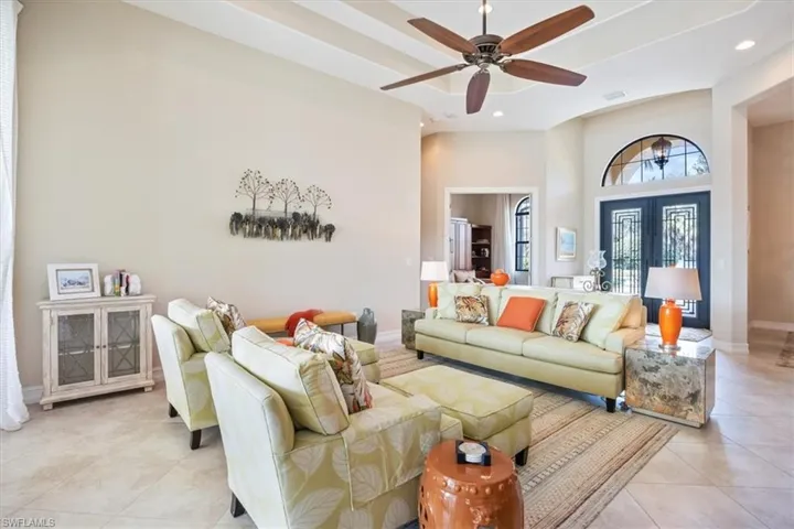 Living area with recessed lighting, a ceiling fan, baseboards, and light tile patterned floors