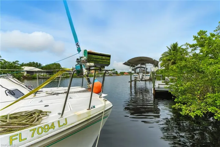 Dock with a water view and boat lift