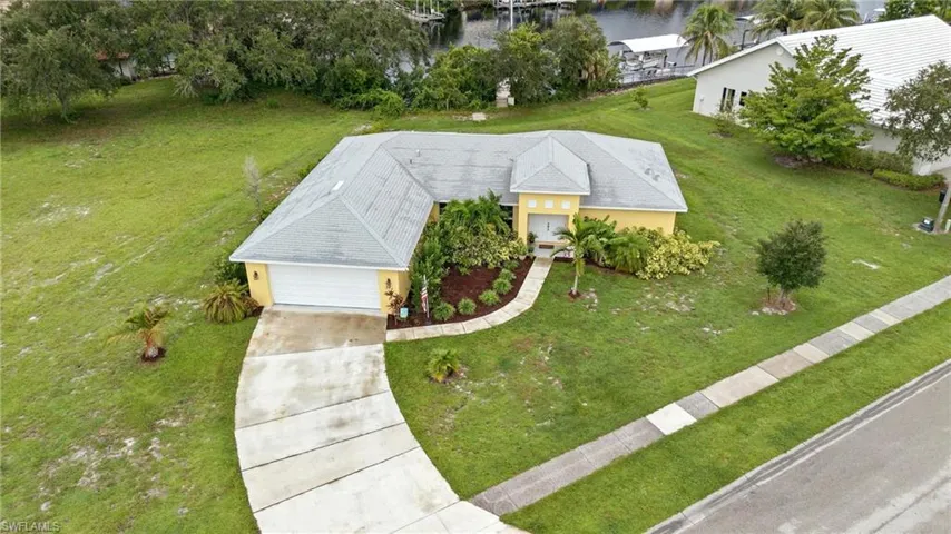 View from above of property with a nearby body of water