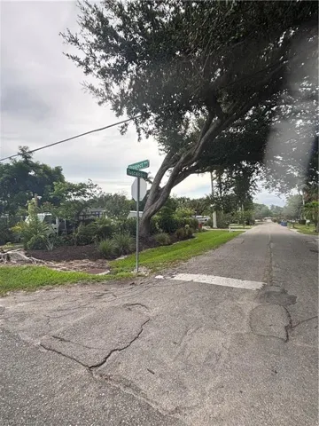 View of asphalt road with traffic signs