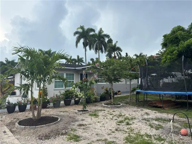 View of yard with a trampoline