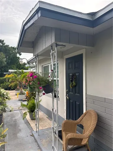 Entrance to property featuring stucco siding and a patio