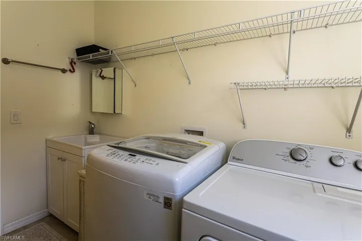Separated washer and dryer with laundry tub. Quiet Rheem Air Handler installed 2022.