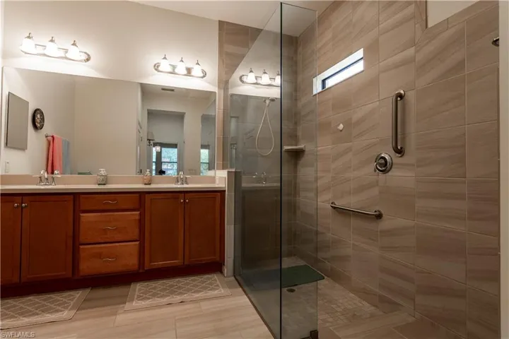 Ensuite bath with double sinks and walk in shower.