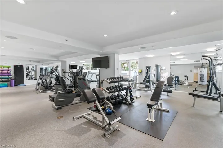 Community fitness center by lobby.