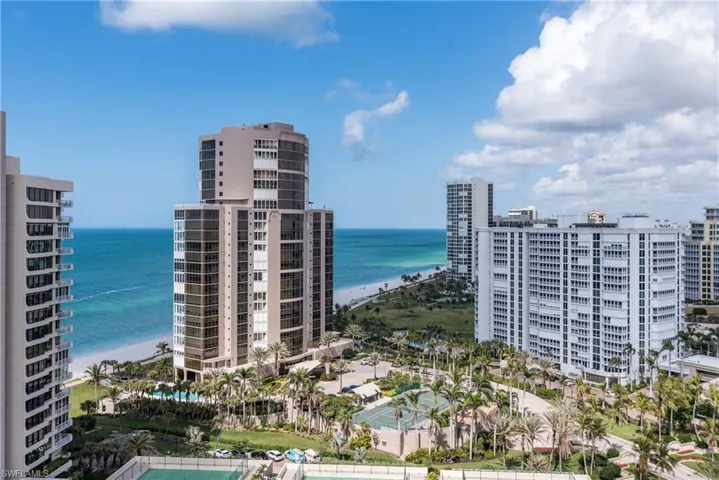 Nearby buildings beyond the Gulf Shore Blvd. N. security gated entrance.