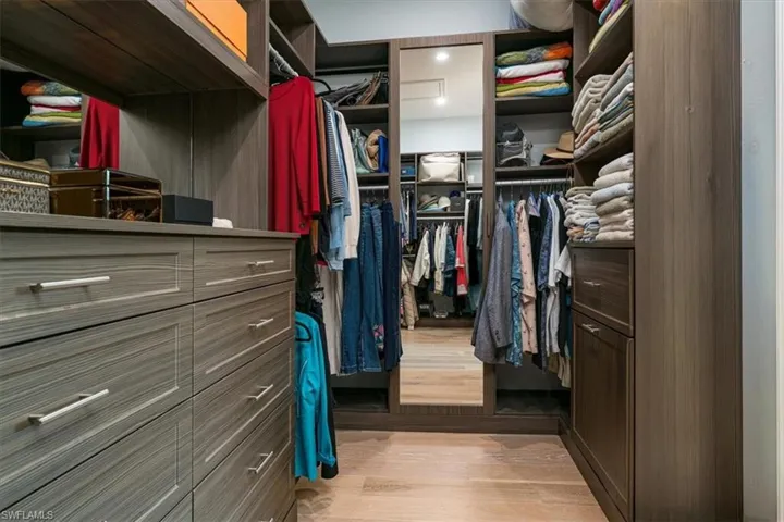 Master Suite Large Walk-in Closet with Custom Shelving