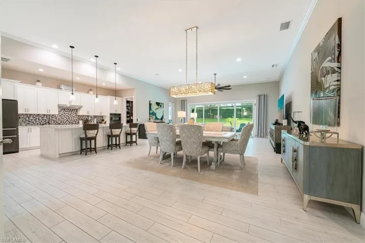 Formal Dining Area with Custom Lighting Fixture