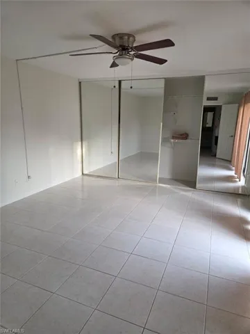 Unfurnished bedroom featuring a closet and ceiling fan