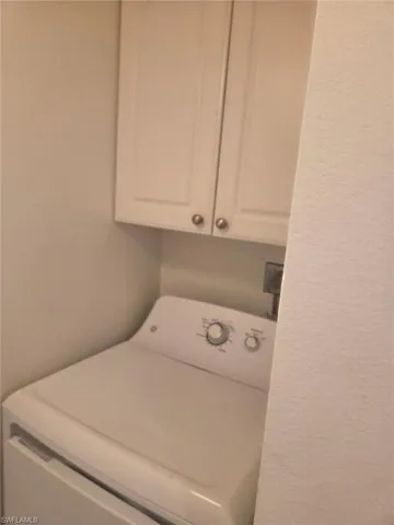 Washroom with washer / dryer and cabinet space