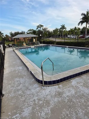 Community pool with a patio area