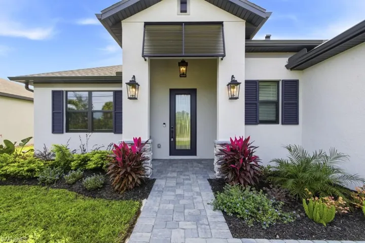 Entrance to property featuring stucco siding