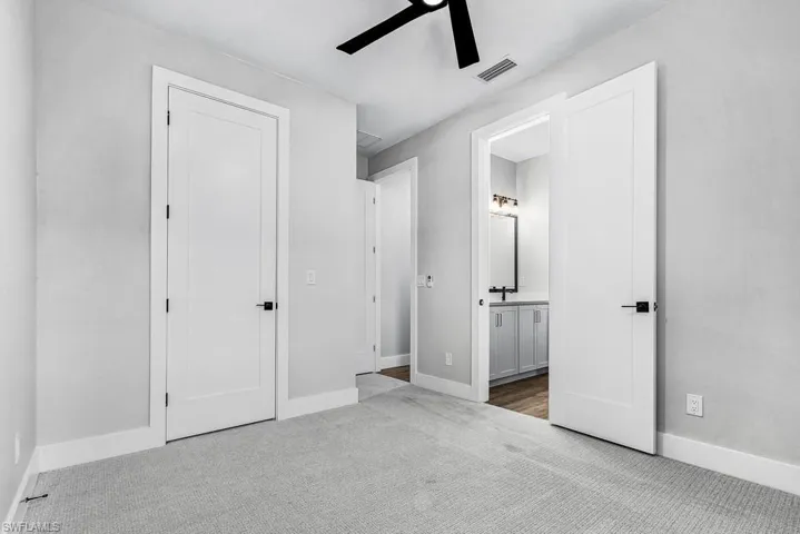 Full bathroom featuring a shower stall and toilet
