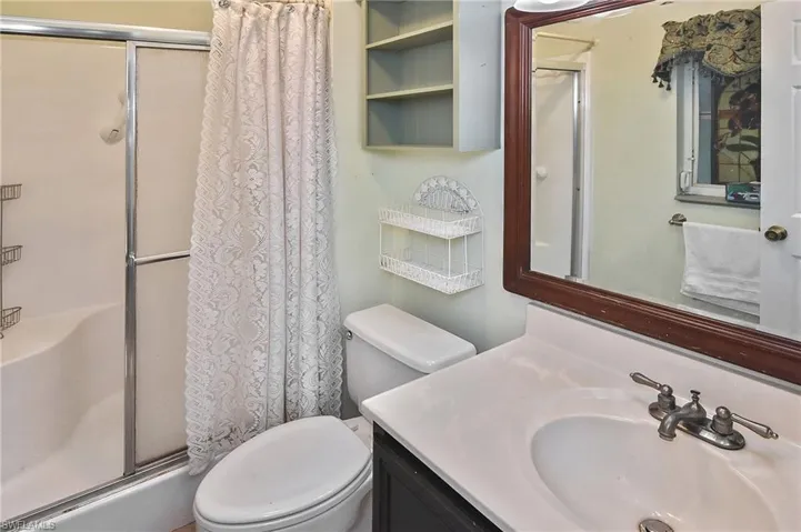 Full bathroom with a stall shower and vanity