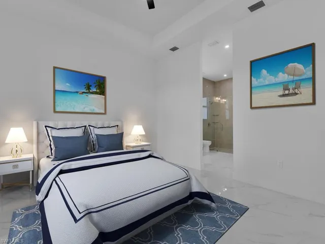 Bedroom featuring ensuite bath and ceiling fan