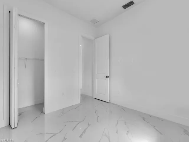 Unfurnished bedroom with a closet