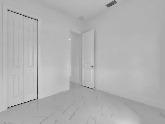 Unfurnished bedroom featuring a closet