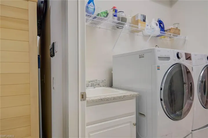 Laundry room with washing machine and dryer