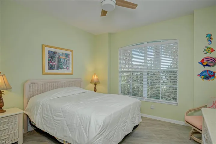 Bedroom with baseboards and a ceiling fan