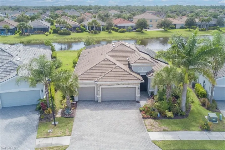 Aerial view of residential area with a large body of water