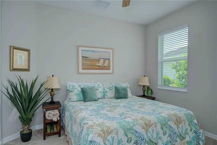 Bedroom with baseboards and a ceiling fan