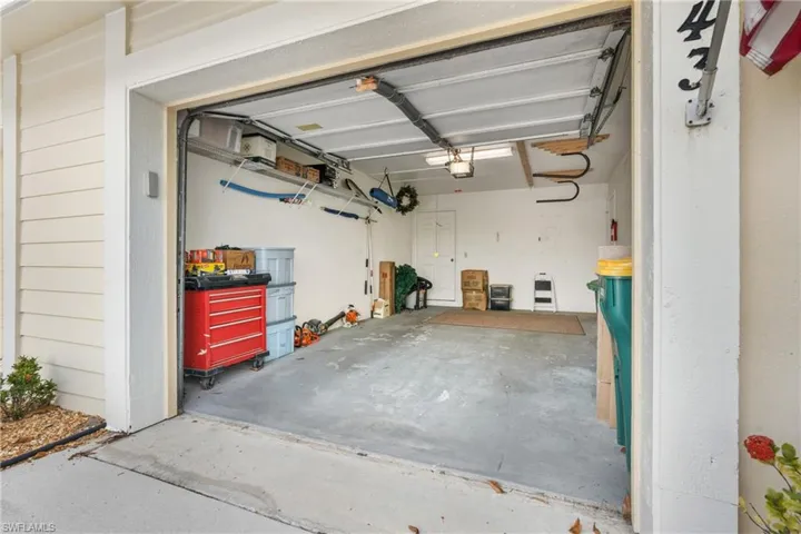 Garage featuring a garage door opener