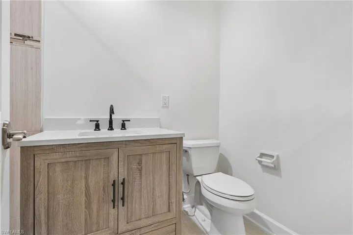 Bathroom with toilet and vanity