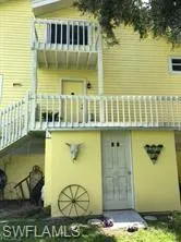 Rear view of property featuring a balcony