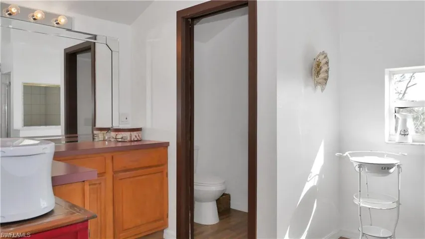 Bathroom featuring light wood-type flooring and vanity