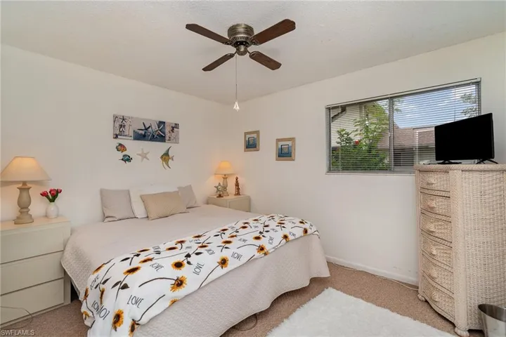Primary bedroom featuring ceiling fan