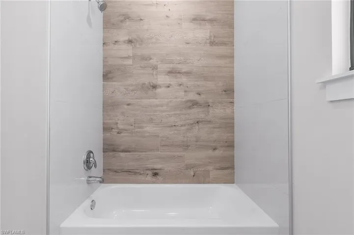 Bathroom featuring bathing tub / shower combination