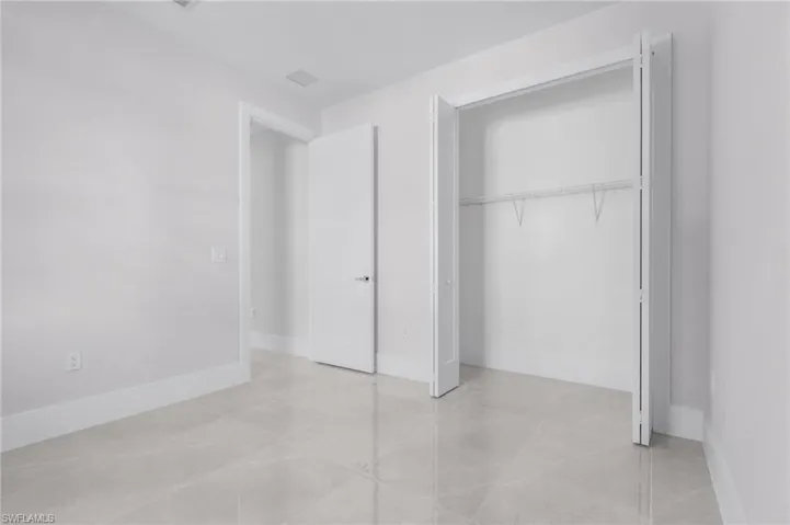 Unfurnished bedroom with a closet