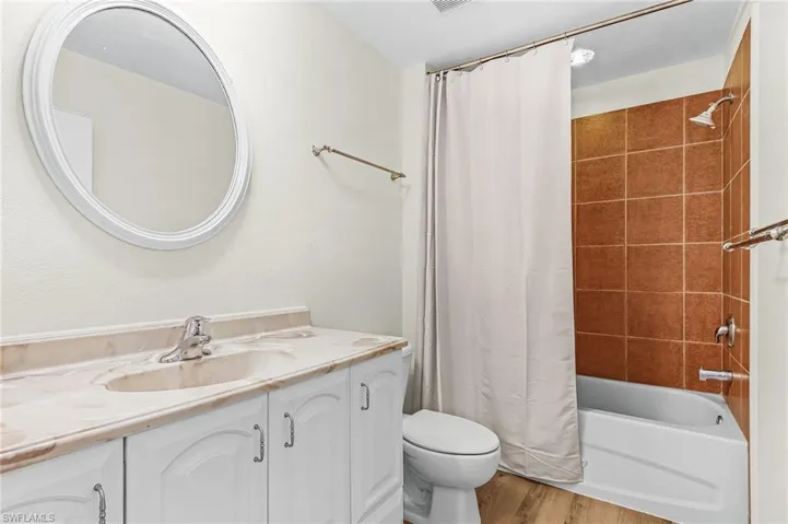 Vanity with dual integrated sinks and a light-toned countertop