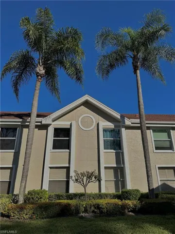View of side of property featuring stucco siding