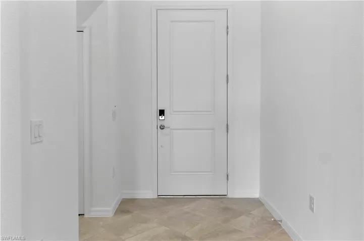 Corridor featuring baseboards
