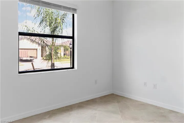 Unfurnished room featuring baseboards