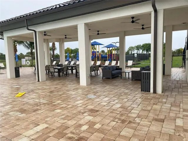 View of patio / terrace featuring ceiling fan and an outdoor living / dining area