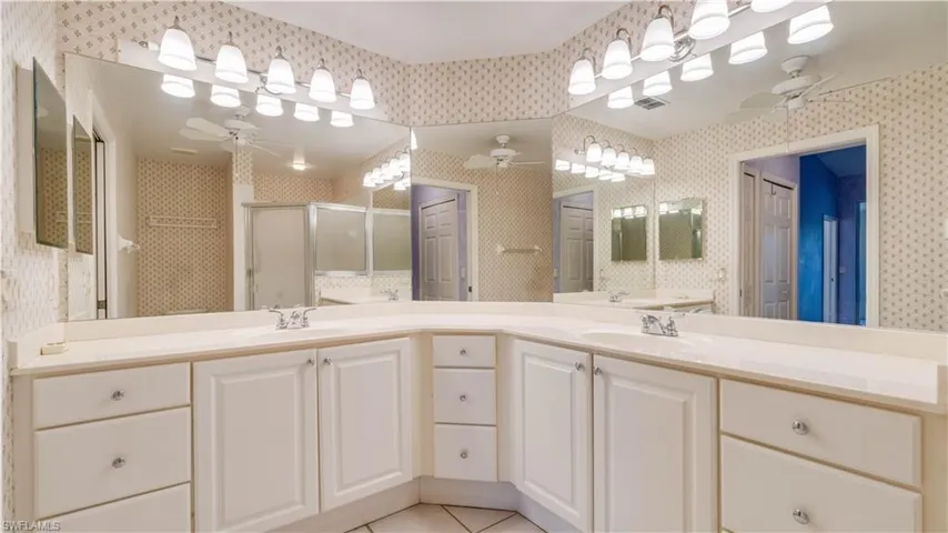 Primary Bathroom with Dual Sinks and shower