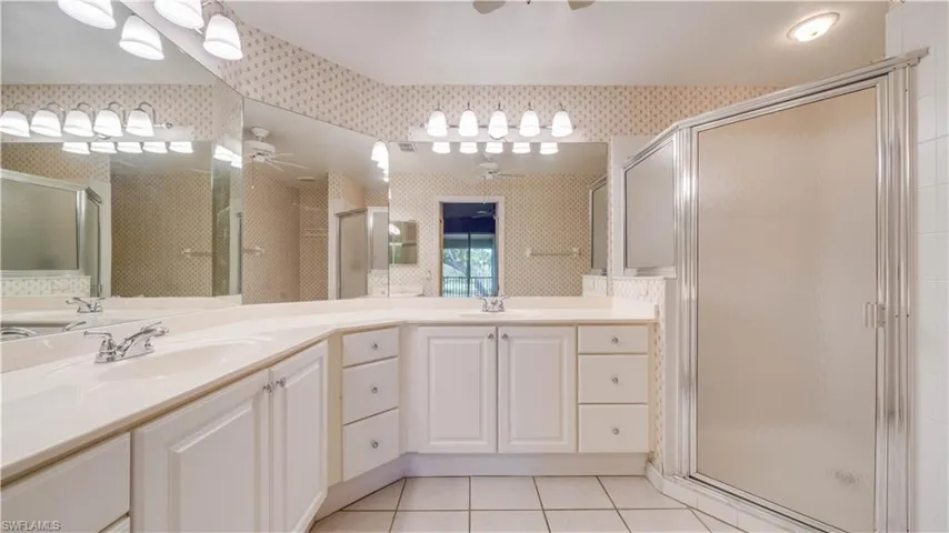 Primary Bathroom with Dual Sinks and shower